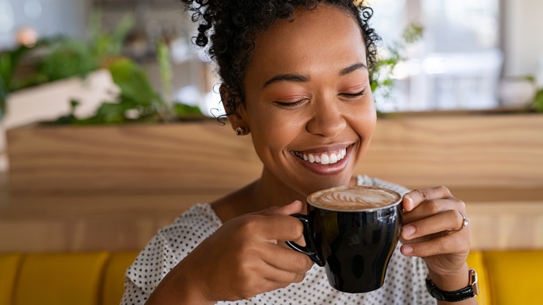 Woman enjoys a cup of coffee