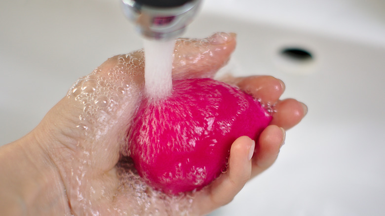 Makeup sponge being cleaned
