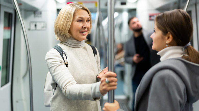 Two women talking in train