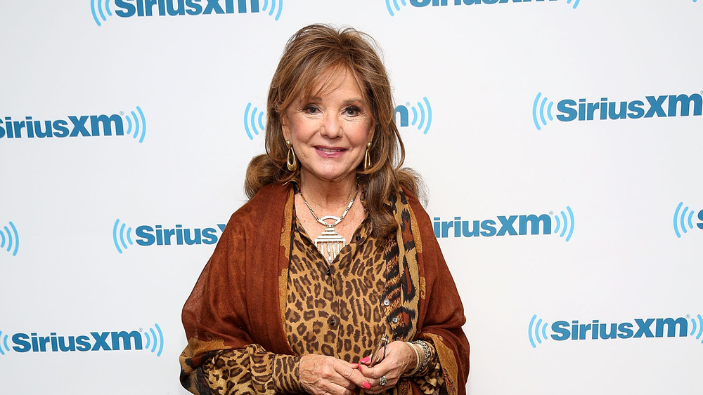 Dawn Wells smiling in leopard top