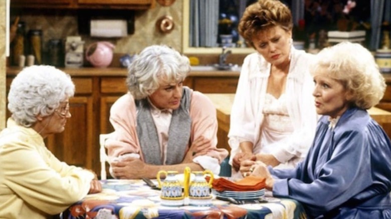 The Golden Girls around the table. 