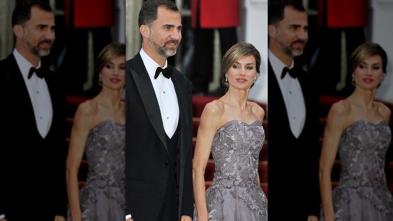 King Felipe & Queen Letizia walking in formal evening attire