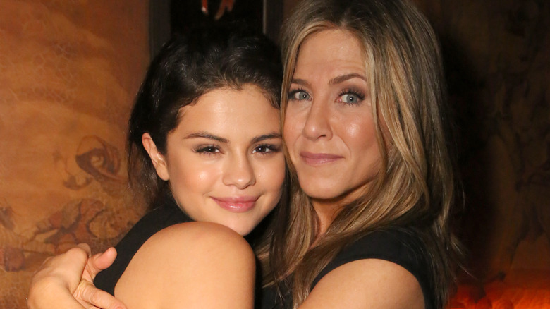 Selena Gomez and Jennifer Aniston hug one another