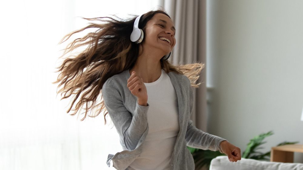 Woman dancing in her living room