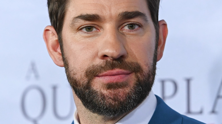 John Krasinski smiling slightly