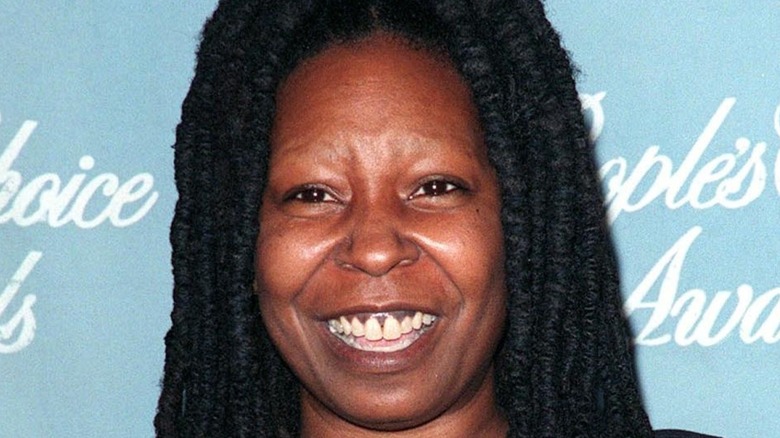 Whoopi Goldberg smiles