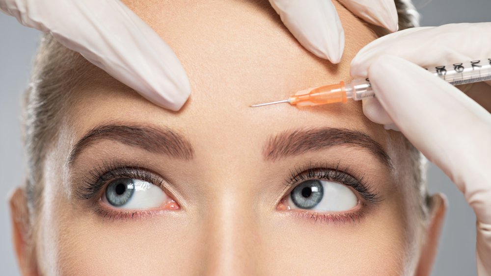 Woman being injected with botox