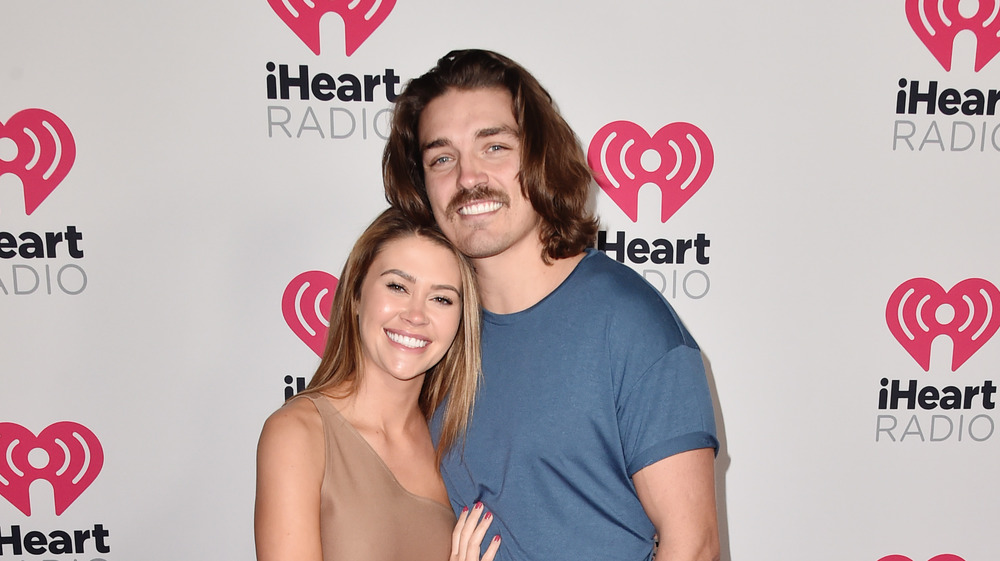 Dean Unglert and Caelynn Miller-Keyes smiling on red carpet