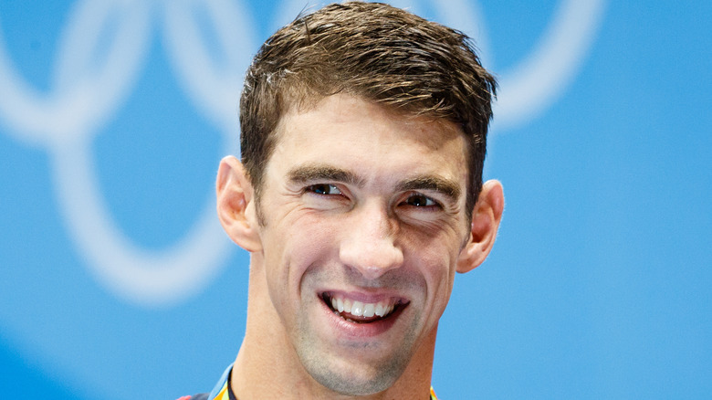 Michael Phelps smiles at an event