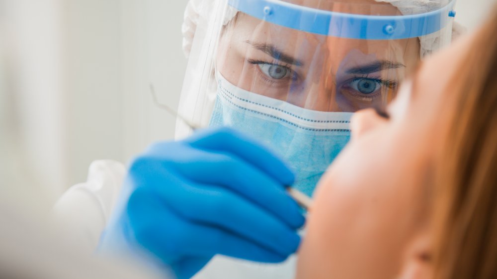 Dentist checking teeth