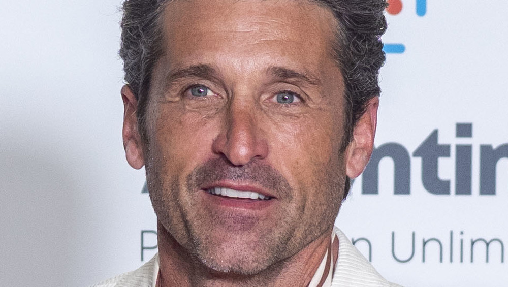 close up of Patrick Dempsey wearing white