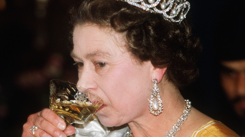 Queen Elizabeth drinking in the 80s