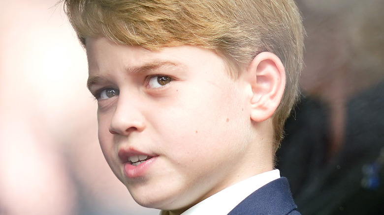 Prince George looking out a car window
