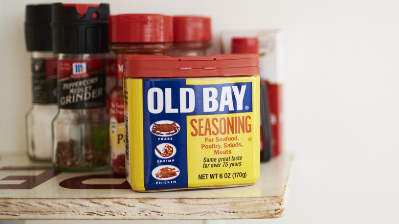 Old Bay Seasoning on shelf with other spices