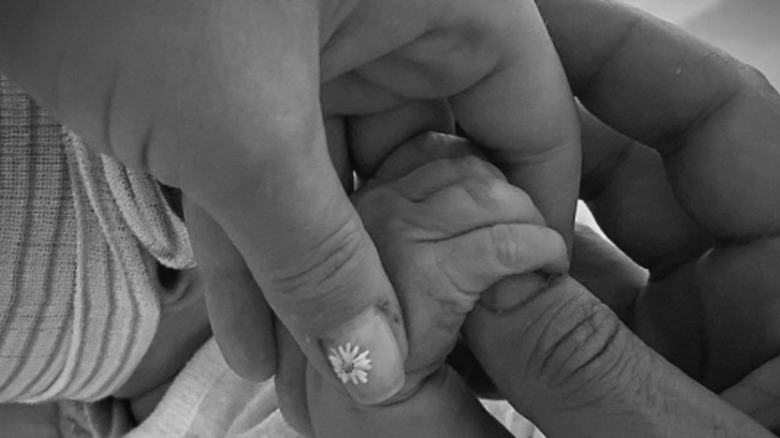 Katy Perry, Orlando Bloom, and Daisy Dove Bloom holding hands