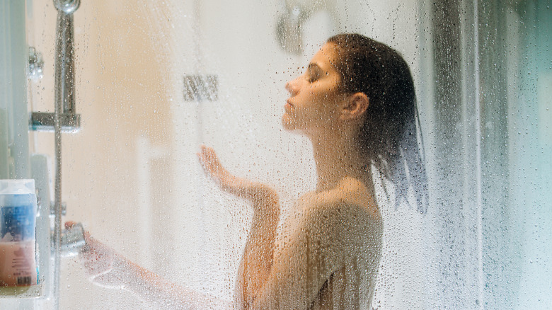 Woman taking a cold shower