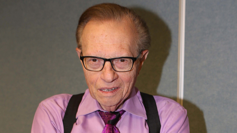 Larry King wears suspenders