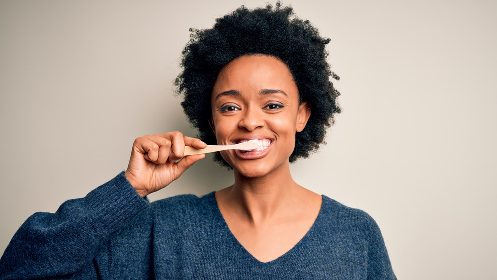 Woman brushing her teeth