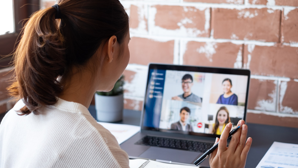 Woman on Zoom meeting with coworkers 