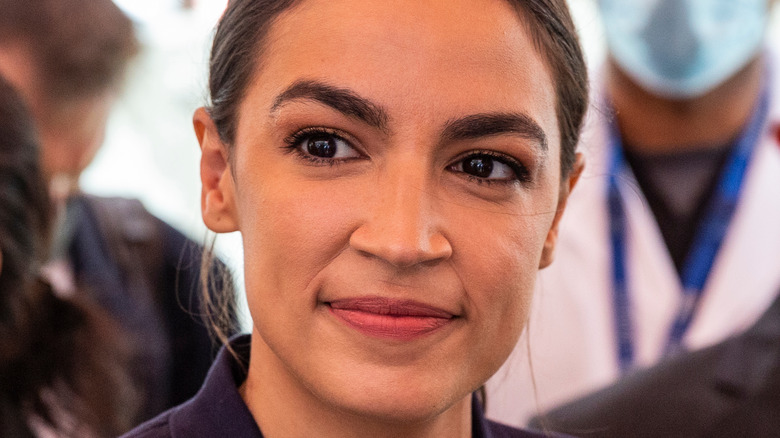 Alexandria Ocasio-Cortez half-smiling