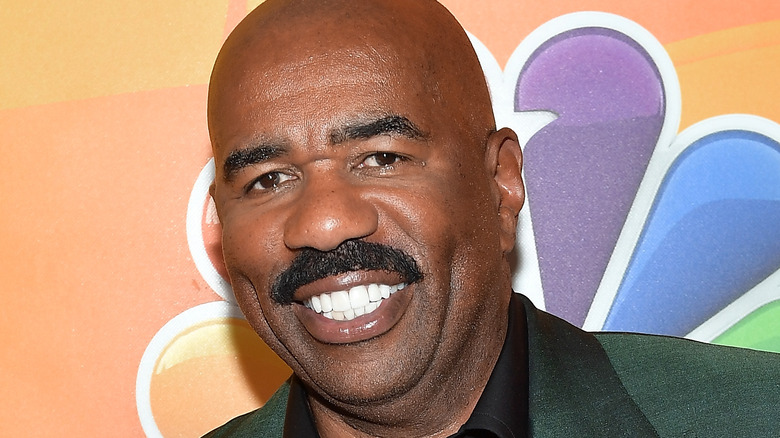 Steve Harvey smiling on the red carpet