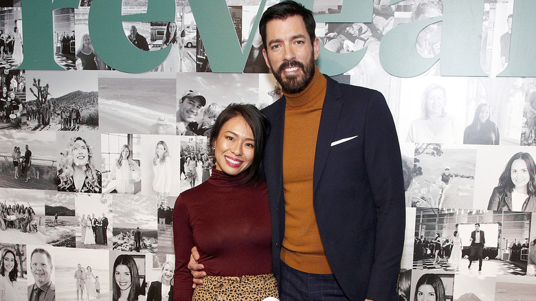 Drew Scott and Linda Phan smiling on the red carpet