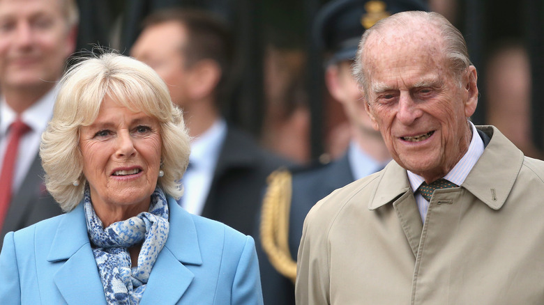 Duchess Camilla standing with Prince Philip