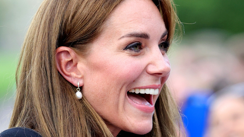 Catherine Middleton smiling widely while meeting fans
