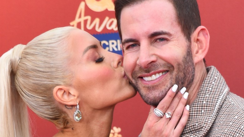 Heather Rae El Moussa kisses husband Tarek El Moussa at the MTV Movie Awards