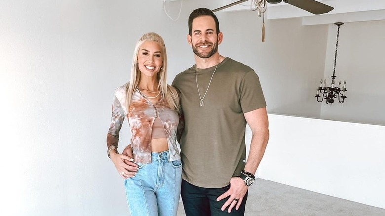 Heather Rae and Tarek El Moussa pose together during a house flip