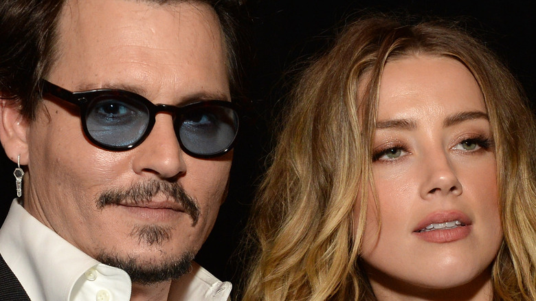 Johnny Depp and Amber Heard standing together