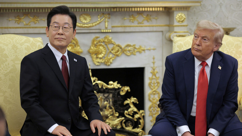Trump and the South Korean president sitting in front of the gilded Oval Office fireplace