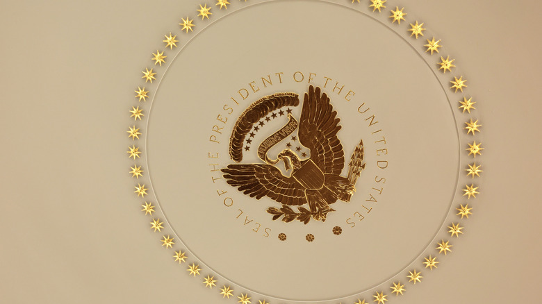 Gilded presidential seal Oval Office