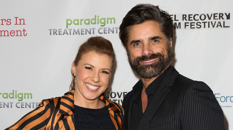 Full House's Jodie Sweetin and John Stamos smiling