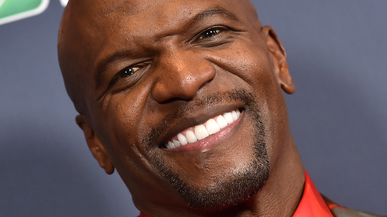Terry Crews smiles at an event