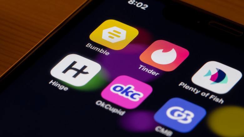 Dating apps on a phone screen: Bumble, Tinder, Plenty of Fish, Hinge and OkCupid