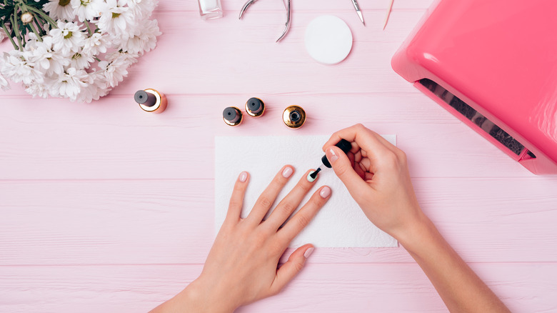 woman painting nails