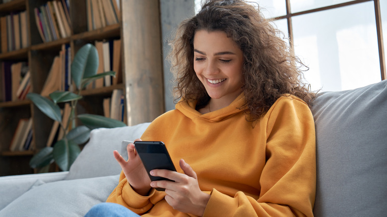 Girl looks at her phone