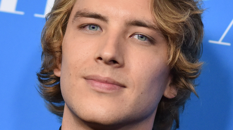 Cody Fern smirking at event 