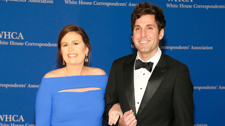 Sarah Huckabee Sanders and Bryan Chatfield Sanders pose on the red carpet