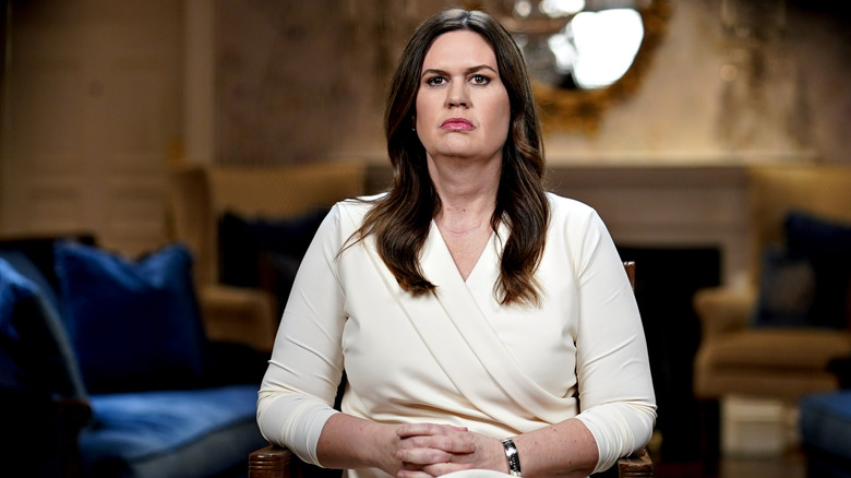 Sarah Huckabee Sanders sitting with her hands intertwined