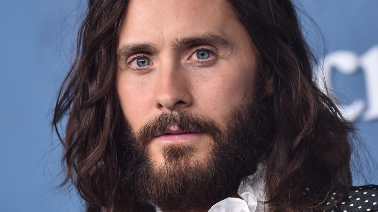 Jared Leto smiling on red carpet