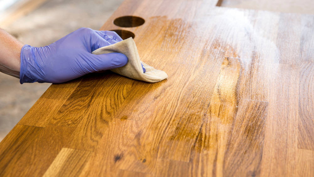 A person cleaning their countertop