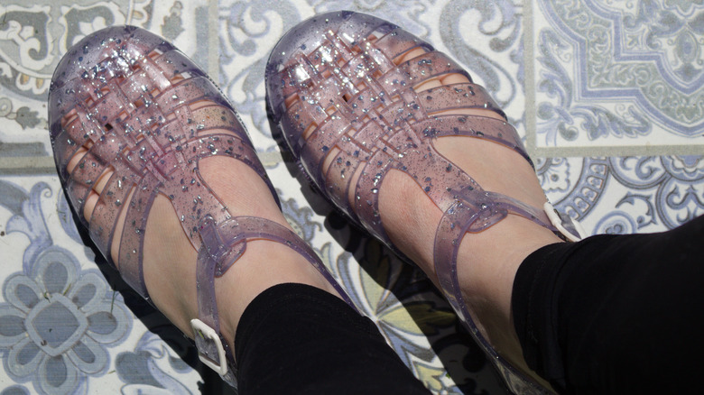 person wearing jelly shoes