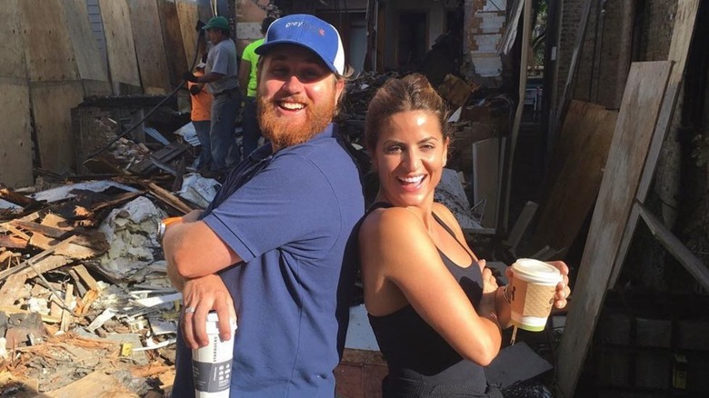 Donovan Eckhardt and Alison Victoria posing back-to-back