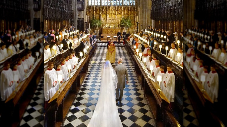 Prince Charles walking Meghan Markle down the aisle at her wedding to Prince Harry