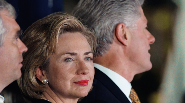 Hillary Clinton looking away from Bill Clinton