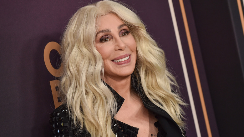 A blonde-haired Cher smiling
