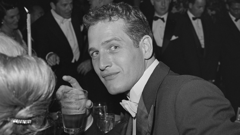 Paul Newman has a drink at a function