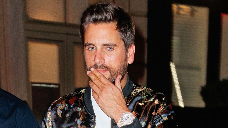 Scott Disick stroking his chin pensively in October 2017
